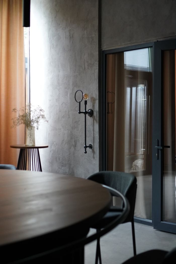 Elegant minimalist interior with natural lighting and modern decor.